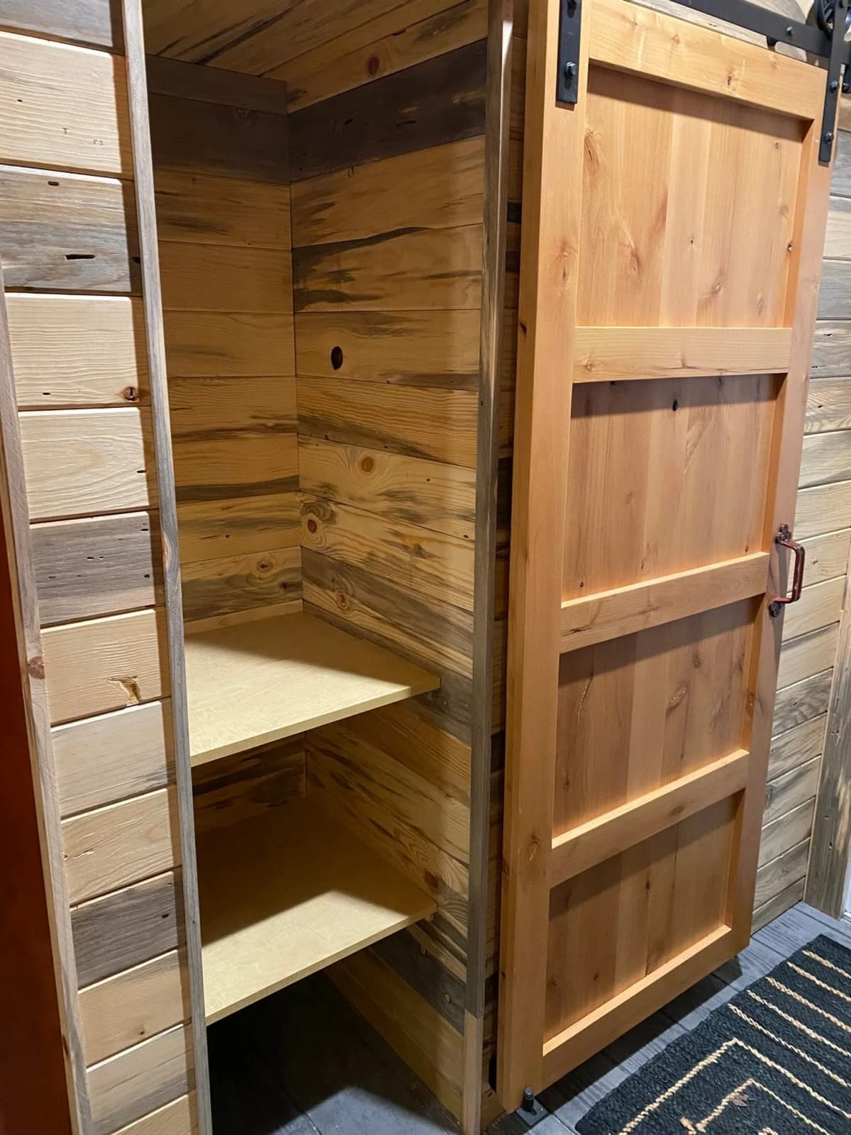 Custom wood barn door and built-in storage in Hugo, MN