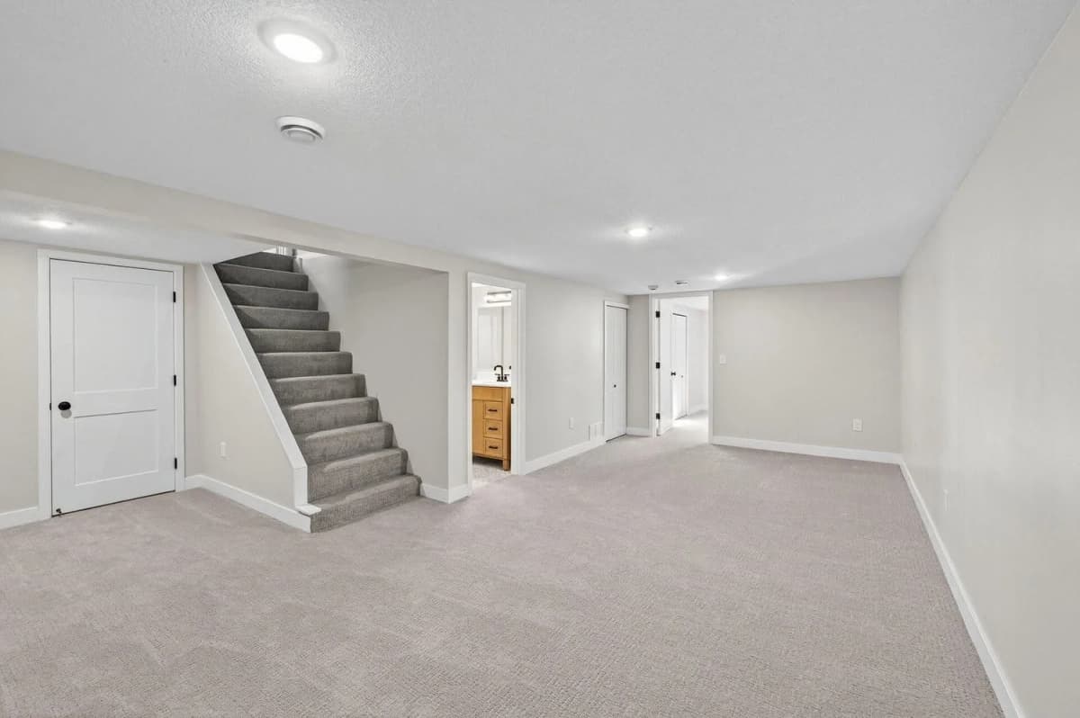 Finished basement living area with new flooring in Hugo, MN