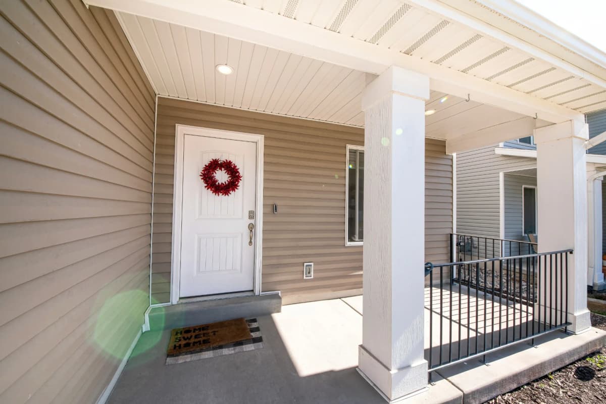 Vinyl siding and a covered front porch on a home in Hugo, MN
